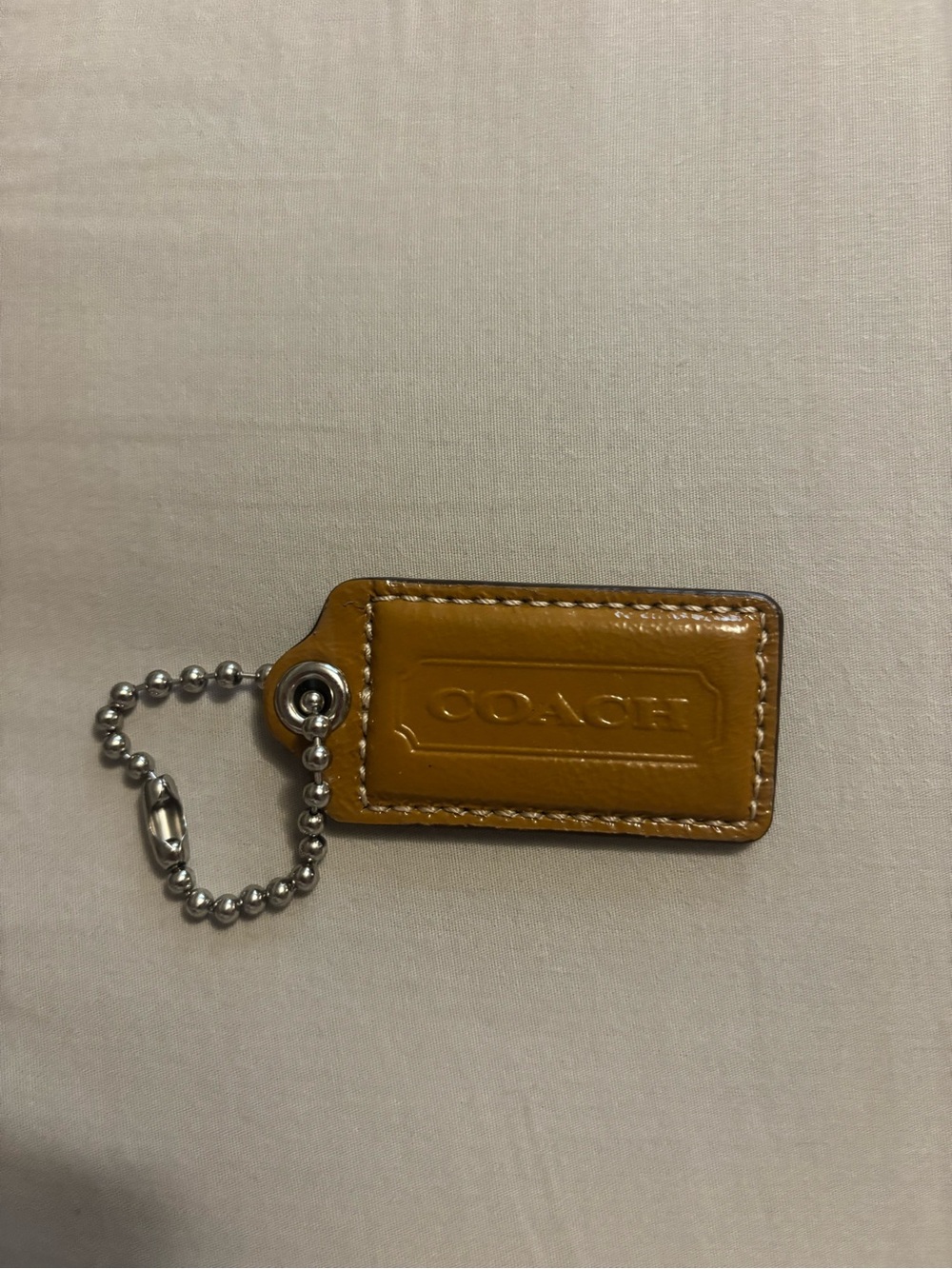 Coach bag tag